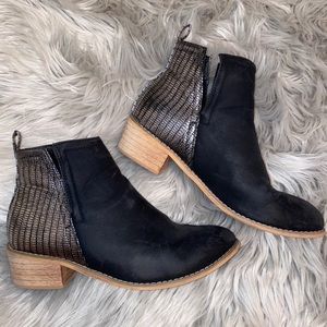 Black open side booties with shimmer back